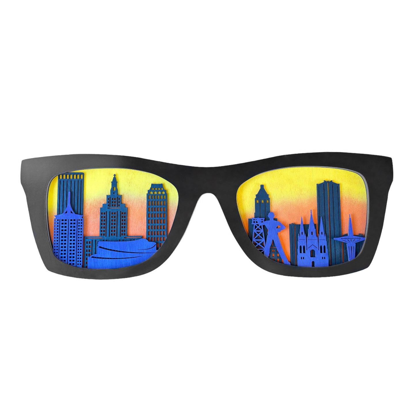Wooden Tulsa skyline decor shaped like sunglasses with layered city buildings and sunset background displayed on white background