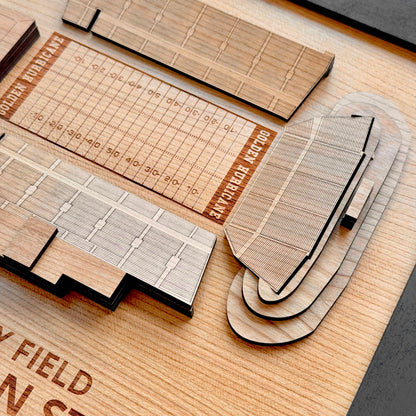Close up detail of layered wood H.A. Chapman Stadium wall art showing engraved football field lines seating sections and dimensional wood layers for Tulsa sports collectors