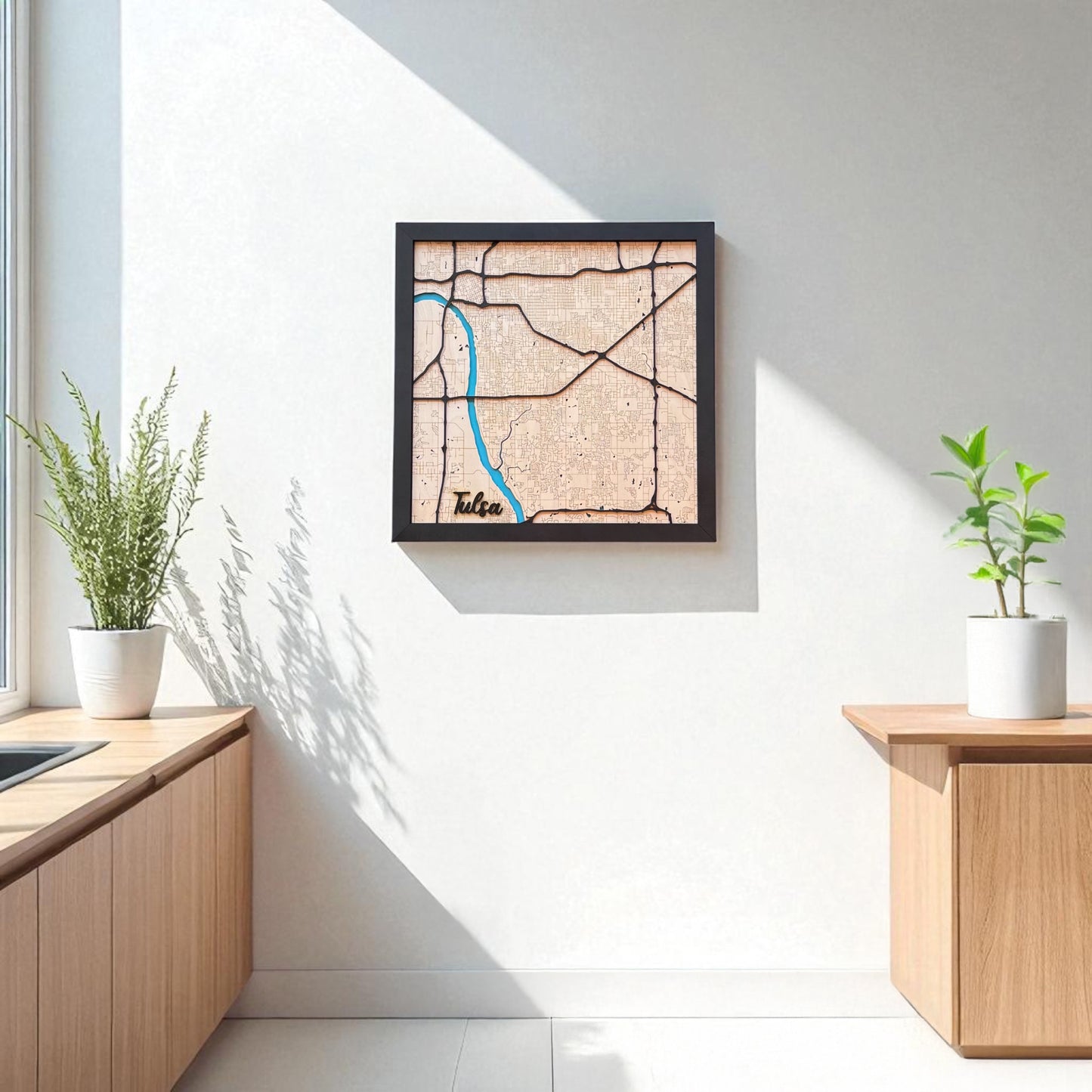 Framed Tulsa wooden city map hanging on a wall in a modern room, layered wood wall art used as Tulsa home decor