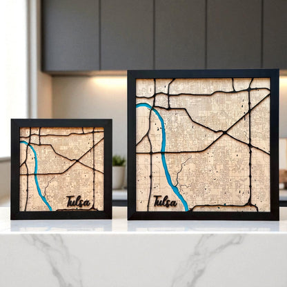 Framed Tulsa wooden city map displayed on a kitchen counter, layered wood wall art with engraved streets and painted river for modern Tulsa home decor