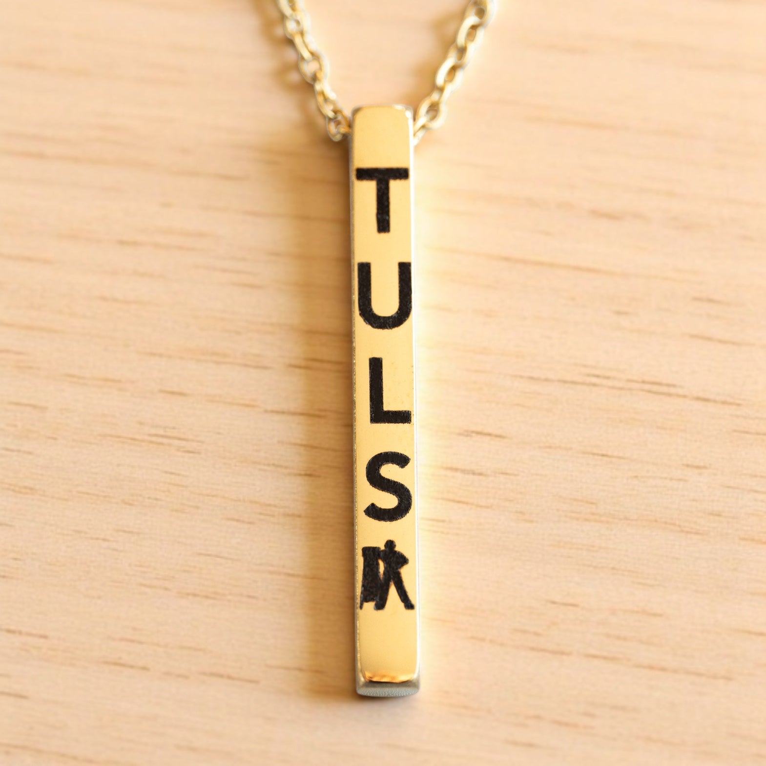 Gold vertical bar necklace engraved with TULSA and Tulsa Driller icon, minimalist Oklahoma jewelry gift