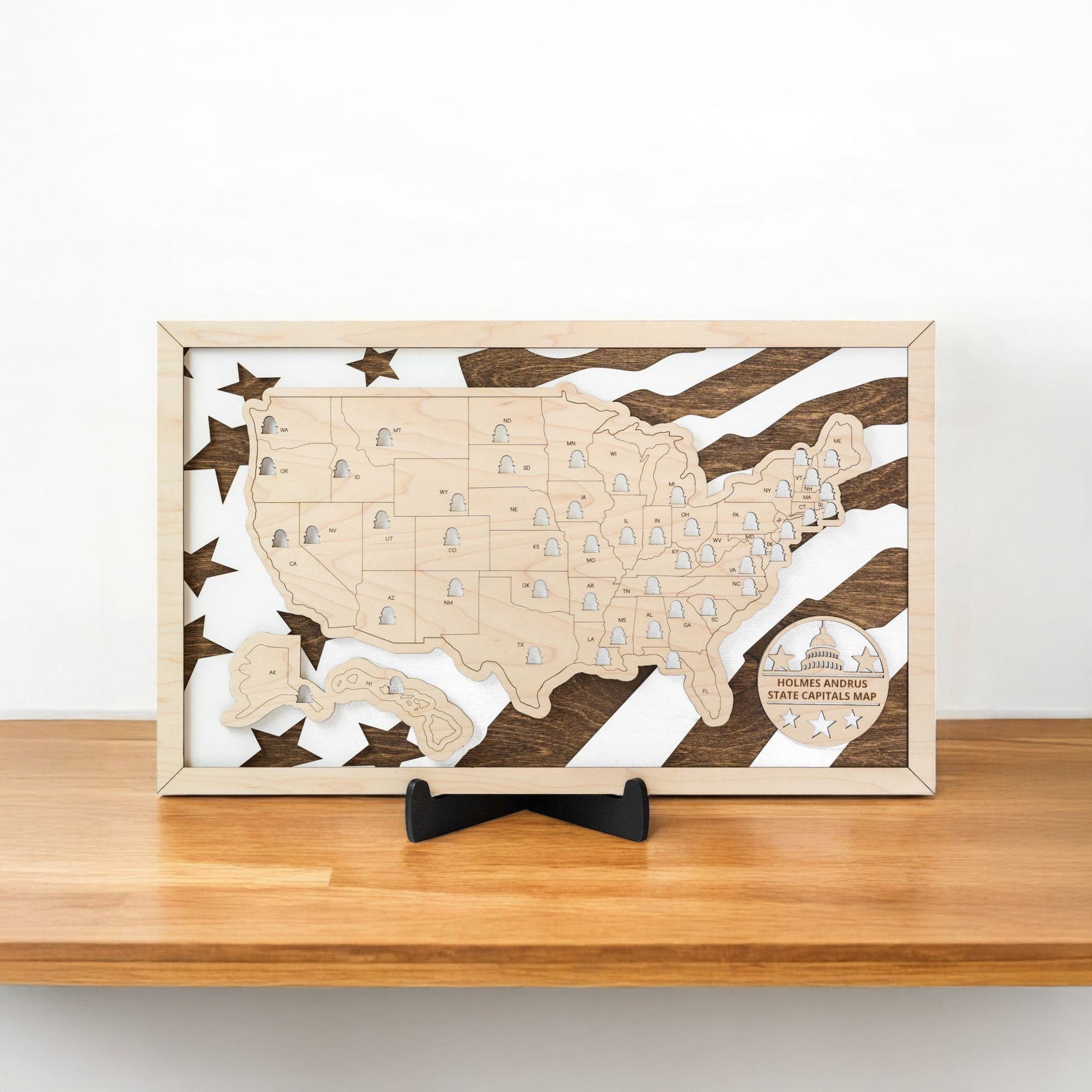 Wooden USA state capitals travel map displayed on a shelf showing layered wood construction