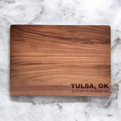 Solid walnut cutting board with custom engraved text, smooth food safe finish and natural dark wood grain