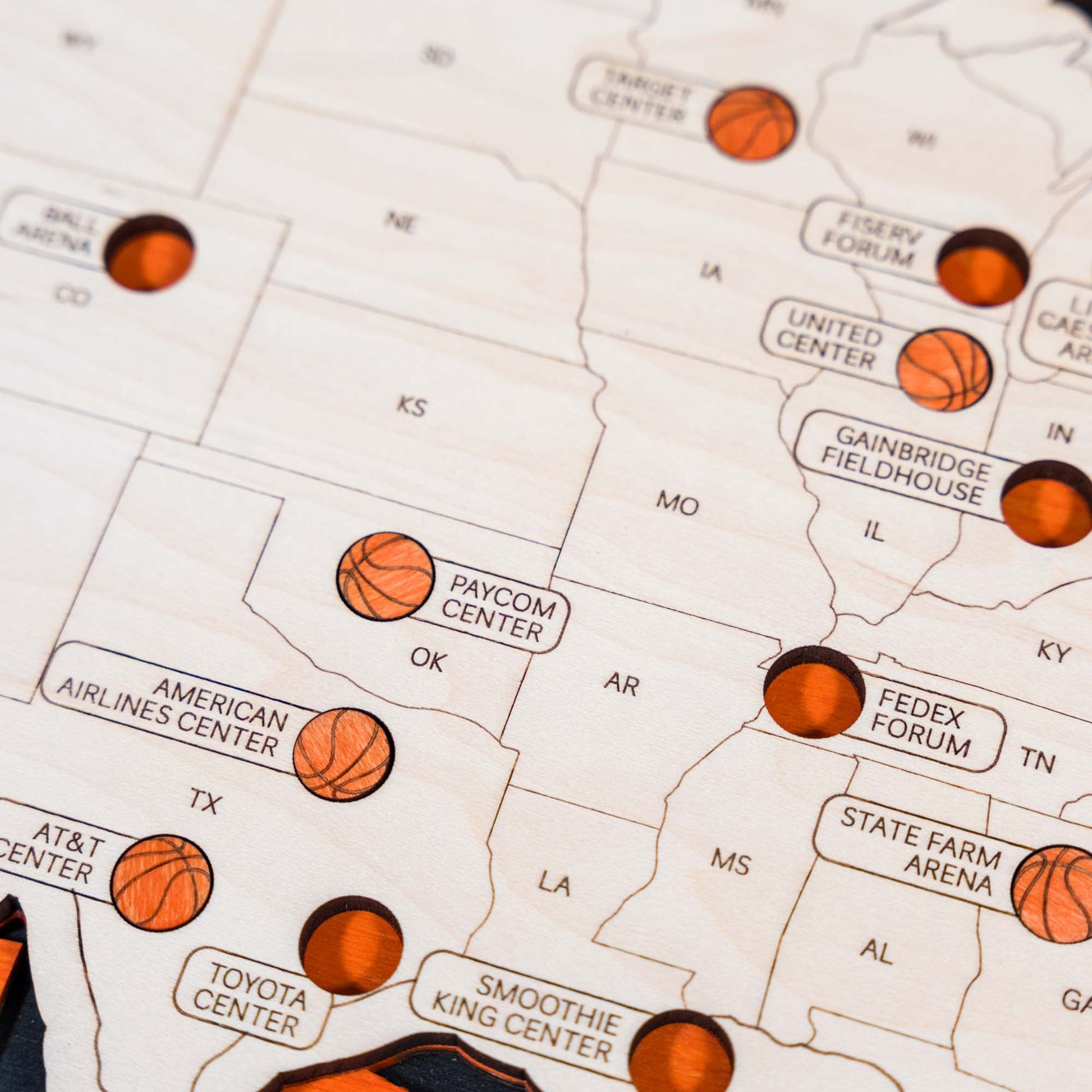 Handcrafted wooden map featuring basketball arenas across the USA, complete with basketball-themed accents