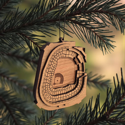 Angled view of Yankee Stadium wooden ornament hanging from black cord, layered wood baseball stadium ornament for sports fan gift