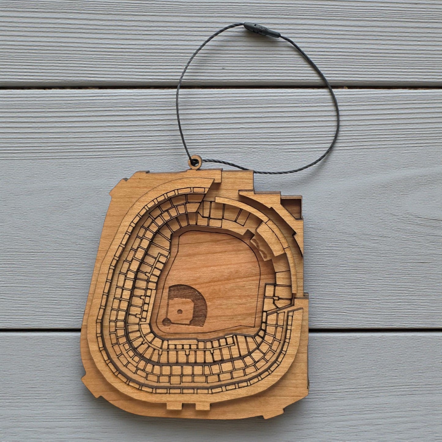 Flat lay of Yankee Stadium wooden ornament with engraved seating and field layout, baseball stadium ornament made from wood for MLB fan decor