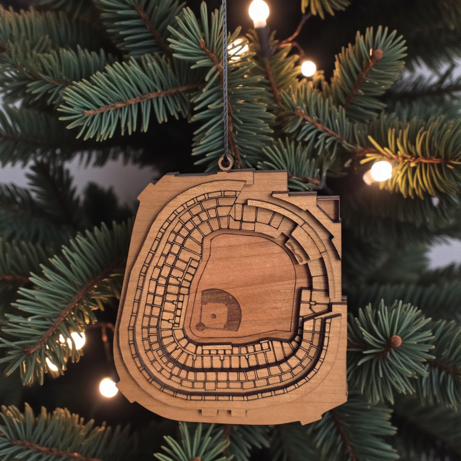 Yankee Stadium wooden ornament hanging on evergreen tree with warm lights, laser cut MLB stadium ornament used as baseball Christmas decor